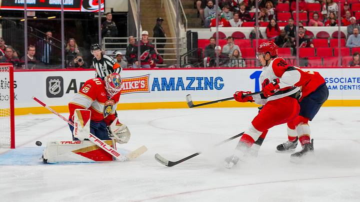Sep 22, 2026; Raleigh, North Carolina, USA;  Florida Panthers goaltender Akira Schmid (40) stops the shot attempt by Carolina Hurricanes forward Felix Unger Sorum (36) during the third period at Lenovo Center.  Mandatory Credit: James Guillory-Imagn Images