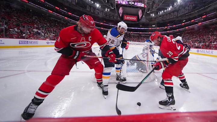 Nov 17, 2024; Raleigh, North Carolina, USA; aCarolina Hurricanes center Jordan Staal (11) left wing William Carrier (28) battle for the puck against St. Louis Blues defenseman Justin Faulk (72) during the third period at Lenovo Center. Mandatory Credit: James Guillory-Imagn Images Nov 17, 2024; Raleigh, North Carolina, USA; aCarolina Hurricanes center Jordan Staal (11) left wing William Carrier (28) battle for the puck against St. Louis Blues defenseman Justin Faulk (72) during the third period at Lenovo Center. Mandatory Credit: James Guillory-Imagn Images