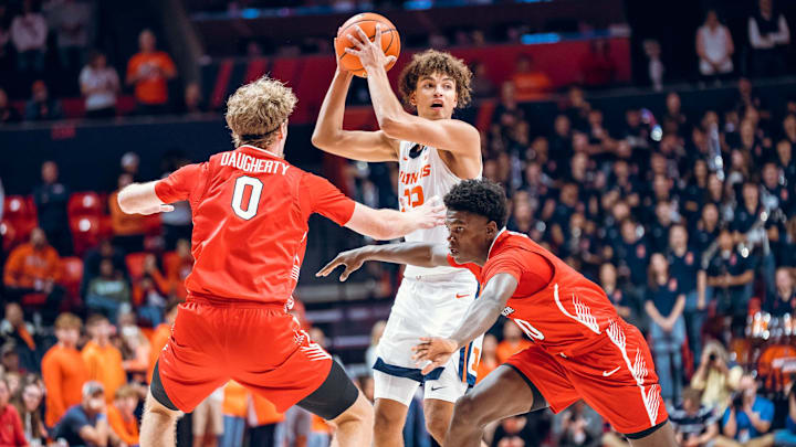 Illinois freshman guard Keaton Wagler searches for an open teammate in the Illini's 92-65 exhibition win over Illinois State on Sunday at State Farm Center in Champaign, Illinois. Illinois freshman guard Keaton Wagler searches for an open teammate in the Illini's 92-65 exhibition win over Illinois State on Sunday at State Farm Center in Champaign, Illinois.