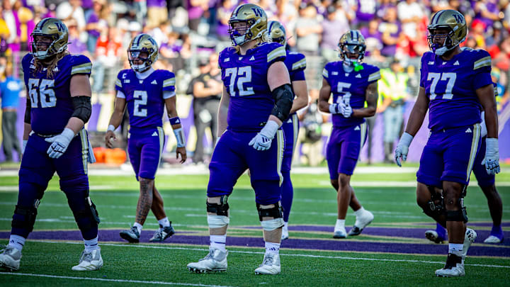 John Mills (72), flanked by Landen Hatchett (66) and Max McCree (77), is just a big guy, with 6-foot-6 and 342-pound dimensions.