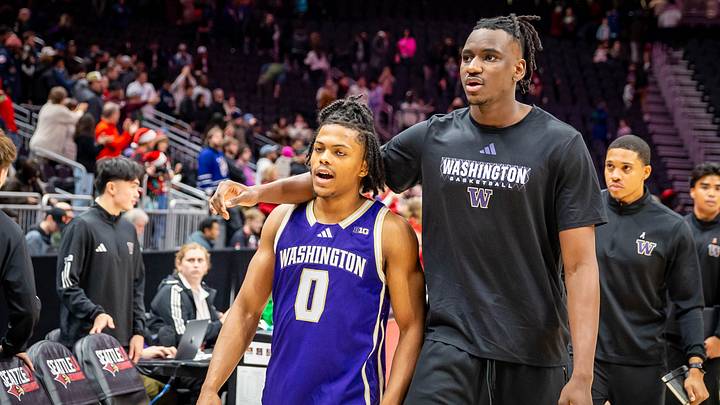 The injured Mady Traore, shown here with Quimari Peterson, tried to be a supportive UW teammate last season. The injured Mady Traore, shown here with Quimari Peterson, tried to be a supportive UW teammate last season.