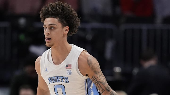 Mar 12, 2026; Charlotte, NC, USA; North Carolina Tar Heels guard Kyan Evans (0) brings the ball up court during the first half against the Clemson Tigers at Spectrum Center. Mandatory Credit: Jim Dedmon-Imagn Images Mar 12, 2026; Charlotte, NC, USA; North Carolina Tar Heels guard Kyan Evans (0) brings the ball up court during the first half against the Clemson Tigers at Spectrum Center. Mandatory Credit: Jim Dedmon-Imagn Images