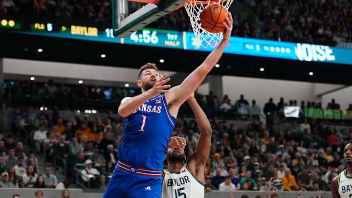 Feb 1, 2025; Waco, Texas, USA;  Kansas Jayhawks center Hunter Dickinson (1) shoots the ball against Baylor Bears forward Norchad Omier (15) during the first half at Paul and Alejandra Foster Pavilion. Mandatory Credit: Chris Jones-Imagn Images