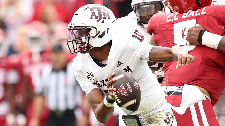 Texas A&M Aggies quarterback Marcel Reed (10) rushes in the first quarter against the Arkansas Razorbacks at Donald W. Reynolds Razorback Stadium. Texas A&M Aggies quarterback Marcel Reed (10) rushes in the first quarter against the Arkansas Razorbacks at Donald W. Reynolds Razorback Stadium.