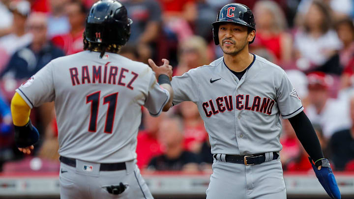 Aug 15, 2023; Cincinnati, Ohio, USA; Cleveland Guardians left fielder Steven Kwan (38) high fives third baseman Jose Ramirez (11) after scoring on a two-run single hit by first baseman Kole Calhoun (not pictured) in the first inning against the Cincinnati Reds at Great American Ball Park. Mandatory Credit: Katie Stratman-USA TODAY Sports