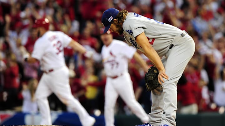 Oct 7, 2014; St. Louis, MO, USA; Los Angeles Dodgers starting pitcher Clayton Kershaw (22) reacts after giving up a three-run home run to St. Louis Cardinals first baseman Matt Adams (32) in the 7th inning during game four of the 2014 NLDS baseball playoff game at Busch Stadium. Mandatory Credit: Jeff Curry-Imagn Images