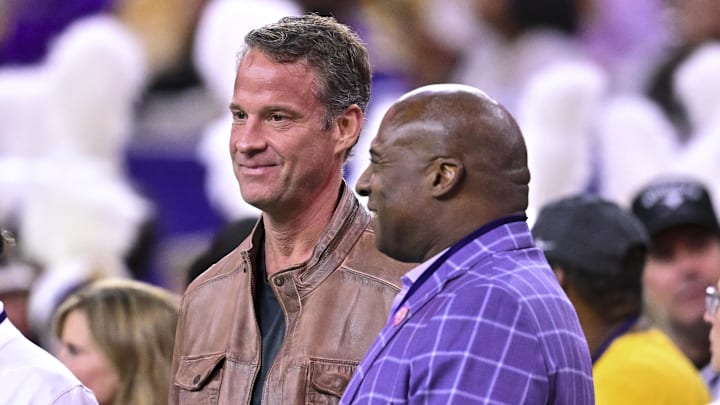 Dec 27, 2025; Houston, TX, USA; Louisiana State Tigers head coach Lane Kiffin, left, stands next to Louisiana State Tigers athletic director Verge Ausberry, right, prior to the game against the Houston Cougars at NRG Stadium. Mandatory Credit: Maria Lysaker-Imagn Images 