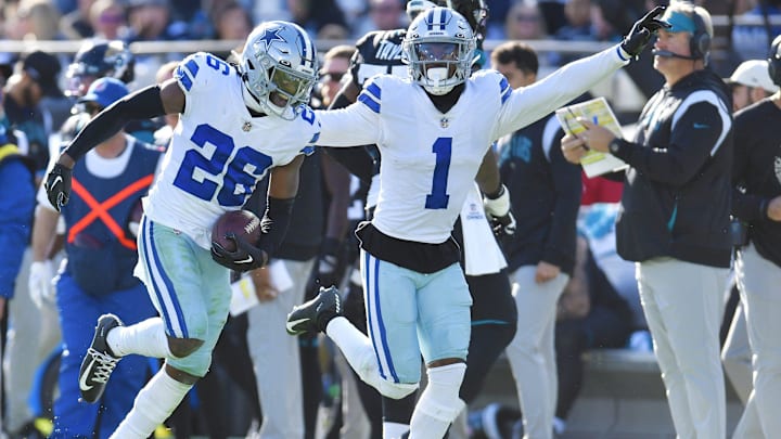 Dallas Cowboys cornerback DaRon Bland (26) and teammate cornerback Kelvin Joseph (1) run down the