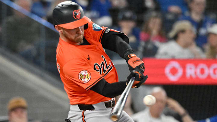 Mar 29, 2025; Toronto, Ontario, CAN;  Baltimore Orioles second baseman Jordan Westburg (11) hits a solo home run against the Toronto Blue Jays in the seventh inning at Rogers Centre