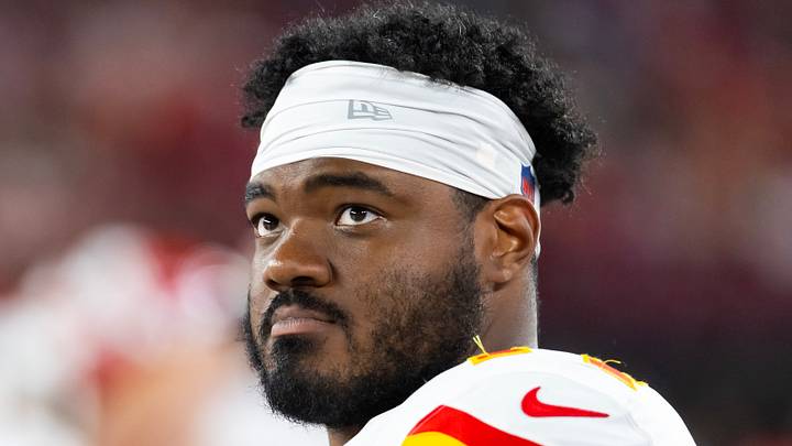 Aug 9, 2025; Glendale, Arizona, USA; Kansas City Chiefs guard Jaylon Moore (77) against the Arizona Cardinals during a preseason NFL game at State Farm Stadium. Mandatory Credit: Mark J. Rebilas-Imagn Images