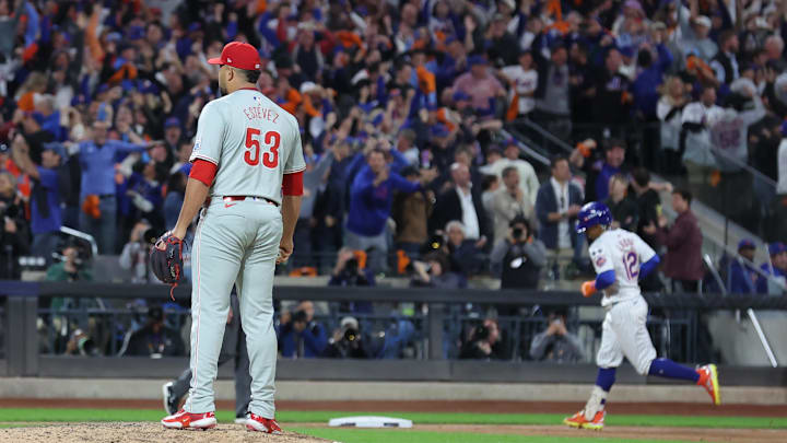 Oct 9, 2024; New York, New York, USA; Philadelphia Phillies pitcher Carlos Estevez (53) reacts after giving up a grand slam to New York Mets shortstop Francisco Lindor (12) in the sixth inning  in game four of the NLDS for the 2024 MLB Playoffs at Citi Field.