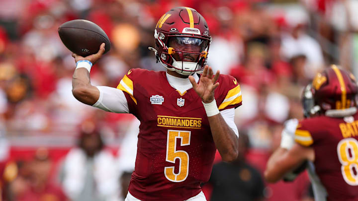 Sep 8, 2024; Tampa, Florida, USA; Washington Commanders quarterback Jayden Daniels (5) drops back to pass against the Tampa Bay Buccaneers in the third quarter at Raymond James Stadium. Mandatory Credit: Nathan Ray Seebeck-Imagn Images