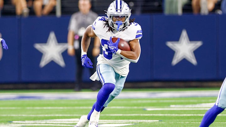 Aug 22, 2025; Arlington, Texas, USA; Dallas Cowboys running back Jaydon Blue (34) carries the ball during the fourth quarter against the Atlanta Falcons at AT&T Stadium.