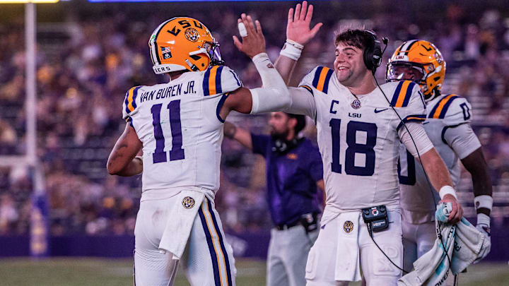 Sep 20, 2025; Baton Rouge, Louisiana, USA;  LSU Tigers quarterback Garrett Nussmeier (18) congratulates LSU Tigers quarterback Michael Van Buren Jr. (11) on a touchdown run against the Southeastern Louisiana Lions during the second half at Tiger Stadium. Mandatory Credit: Stephen Lew-Imagn Images