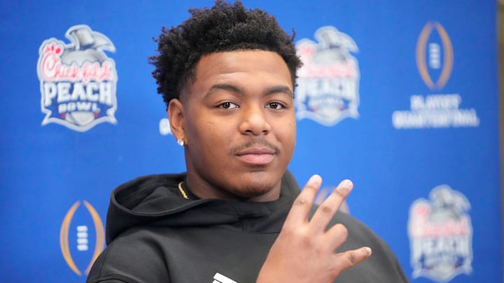 Arizona State defensive lineman C.J. Fite gives the forks up sign during media day for the Chick-fil-A Peach Bowl in Atlanta on Monday, Dec. 30, 2024.