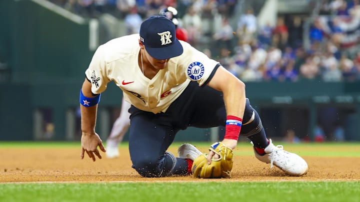 Mar 28, 2025; Arlington, Texas, USA; Texas Rangers third baseman Josh Jung (6) fields a ball during the seventh inning against the Boston Red Sox at Globe Life Field. 
