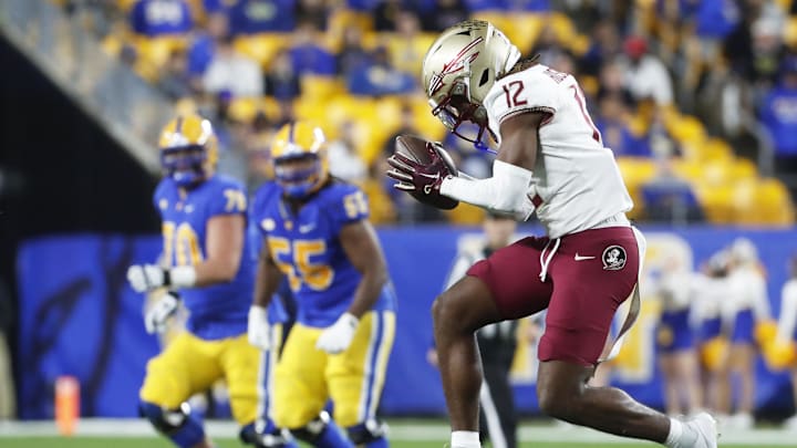 Nov 4, 2023; Pittsburgh, Pennsylvania, USA;  Florida State Seminoles defensive back Conrad Hussey (12) reacts after intercepting a pass against the Pittsburgh Panthers during the fourth quarter at Acrisure Stadium. The Seminoles won 24-7. Mandatory Credit: Charles LeClaire-Imagn Images