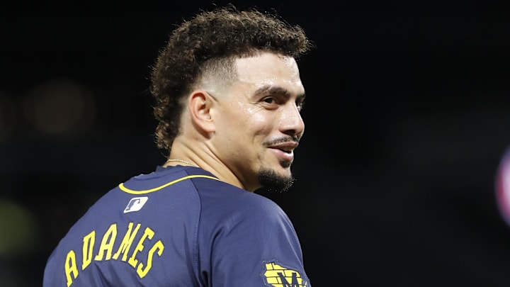 Sep 24, 2024; Pittsburgh, Pennsylvania, USA;  Milwaukee Brewers shortstop Willy Adames (27) gestures to the Pittsburgh Pirates dugout while on third base during the fourth inning at PNC Park