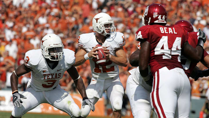 Oct 11, 2008; Dallas, TX, USA;  Texas Longhorns quarterback Colt McCoy (12) throws a pass against the  Oklahoma Sooners  during the Red River Rivalry at the Cotton Bowl. Mandatory Credit: Tim Heitman-Imagn Images