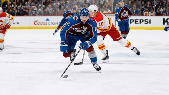 Nov 25, 2023; Denver, Colorado, USA; Colorado Avalanche center Ryan Johansen (12) chases down a loose puck in the second period against the Calgary Flames at Ball Arena. Mandatory Credit: Isaiah J. Downing-Imagn Images