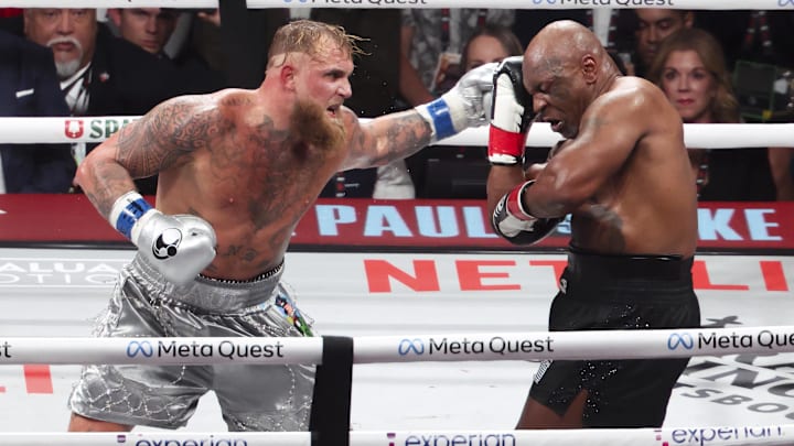 Nov 15, 2024; Arlington, Texas, UNITED STATES;  Mike Tyson (black gloves) fights Jake Paul (silver gloves) at AT&T Stadium. Mandatory Credit: Kevin Jairaj-Imagn Images