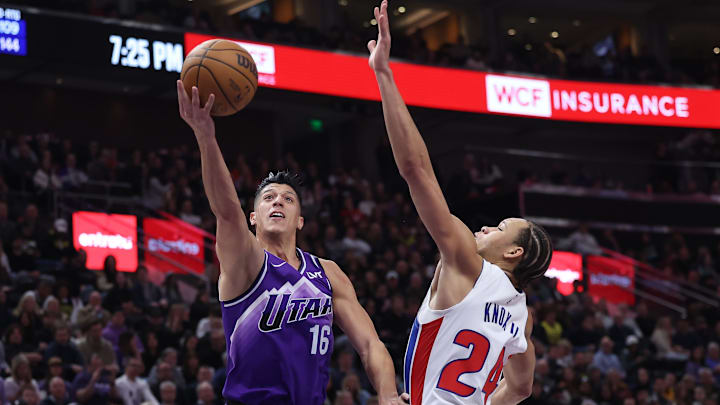 Jan 3, 2024; Salt Lake City, Utah, USA; Utah Jazz forward Simone Fontecchio (16) goes to the basket against Kevin Knox of the Detroit Pistons