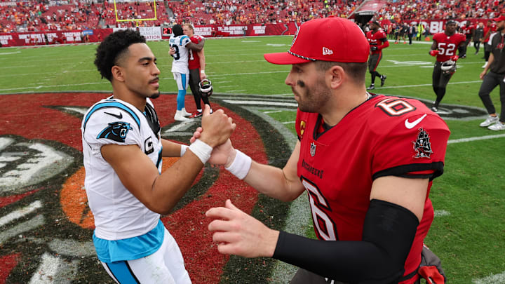 Dec 29, 2024; Tampa, Florida, USA; Tampa Bay Buccaneers quarterback Baker Mayfield (6) great Carolina Panthers quarterback Bryce Young (9) after a game at Raymond James Stadium. Mandatory Credit: Nathan Ray Seebeck-Imagn Images Dec 29, 2024; Tampa, Florida, USA; Tampa Bay Buccaneers quarterback Baker Mayfield (6) great Carolina Panthers quarterback Bryce Young (9) after a game at Raymond James Stadium. Mandatory Credit: Nathan Ray Seebeck-Imagn Images