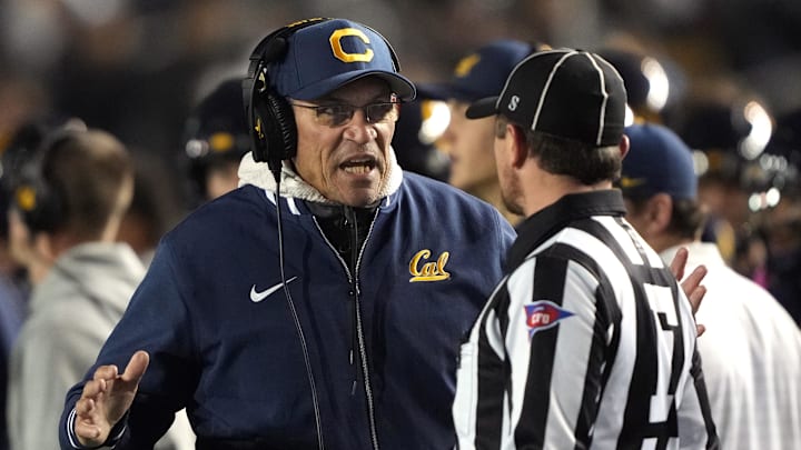 Nov 29, 2025; Berkeley, California, USA; California Golden Bears general manager Ron Rivera (left) talks with field judge Hugh Brown (right) during the third quarter against the Southern Methodist Mustangs at California Memorial Stadium. Mandatory Credit: Darren Yamashita-Imagn Images