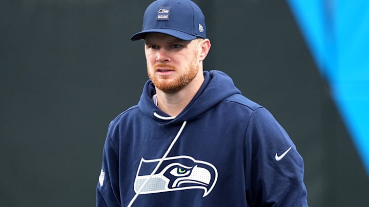 Dec 28, 2025; Charlotte, North Carolina, USA; Seattle Seahawks quarterback Sam Darnold (14) warms up before the game against the Carolina Panthers at Bank of America Stadium.