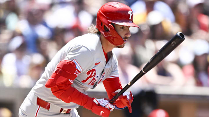Jul 13, 2025; San Diego, California, USA; Philadelphia Phillies second baseman Bryson Stott (5) hits a single during the fourth inning against the San Diego Padres at Petco Park. Jul 13, 2025; San Diego, California, USA; Philadelphia Phillies second baseman Bryson Stott (5) hits a single during the fourth inning against the San Diego Padres at Petco Park.