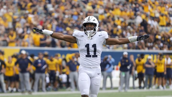 Aug 31, 2024; Morgantown, West Virginia, USA; Penn State Nittany Lions defensive end Abdul Carter (11) celebrates after a defensive stop during the fourth quarter against the West Virginia Mountaineers at Mountaineer Field at Milan Puskar Stadium. Mandatory Credit: Ben Queen-Imagn Images