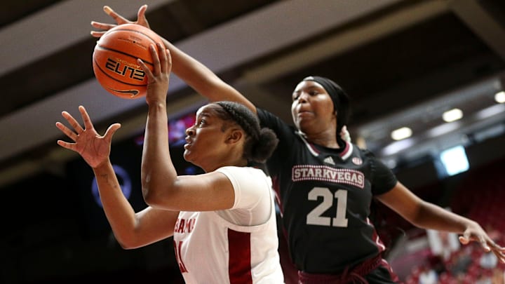 Feb 25, 2024; Tuscaloosa, Alabama, USA; Alabama forward Essence Cody (21) shoots inside with defense by Mississippi State guard Debreasha Powe (21) at Coleman Coliseum Sunday.