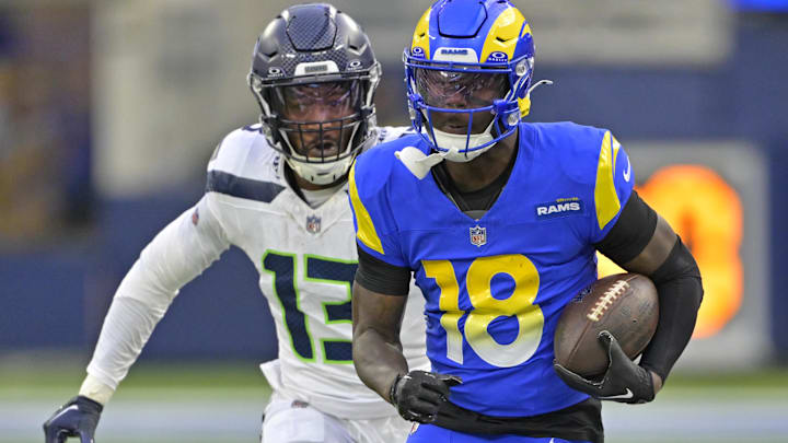 Jan 5, 2025; Inglewood, California, USA; Los Angeles Rams wide receiver Tyler Johnson (18) is chased down by Seattle Seahawks linebacker Ernest Jones IV (13) as he runs for a first down in the second half at SoFi Stadium. Mandatory Credit: Jayne Kamin-Oncea-Imagn Images