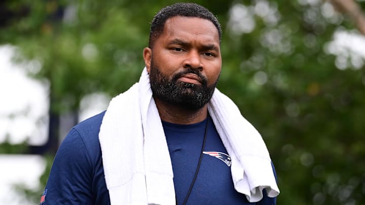 Jul 24, 2024; Foxborough, MA, USA;  New England Patriots head coach Jerod Mayo walks to the podium for a press conference before training camp at Gillette Stadium. Mandatory Credit: Eric Canha-Imagn Images