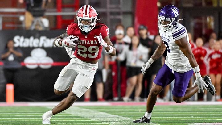 Sep 25, 2026; Bloomington, Indiana, USA; Indiana Hoosiers running back Lee Beebe Jr. (29) runs the ball past Northwestern Wildcats defensive back Brenden Deasfernandes (3) during the first half at Merchants Bank Field at Memorial Stadium. Mandatory Credit: Robert Goddin-Imagn Images