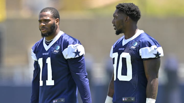 Jul 26, 2023; Oxnard, CA, USA; Dallas Cowboys linebacker Micah Parsons (11) and Dallas Cowboys defensive end DeMarcus Lawrence (90) walk on the field during training camp drill at River Ridge Playing Fields in Oxnard, CA. Mandatory Credit: Jayne Kamin-Oncea-Imagn Images