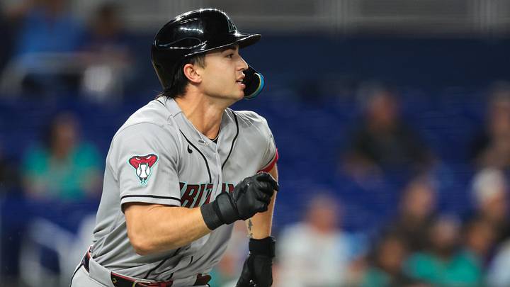 Jun 9, 2026; Miami, Florida, USA; Arizona Diamondbacks left fielder Tommy Troy (9) runs toward first base after hitting a single against the Miami Marlins during the fifth inning at loanDepot Park. Mandatory Credit: Sam Navarro-Imagn Images