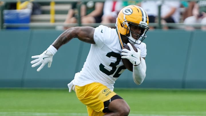 Green Bay Packers running back MarShawn Lloyd (32) runs through a drill during the second day of training camp on Thursday, July 24, 2025, at Ray Nitschke Field in Ashwaubenon, Wis.