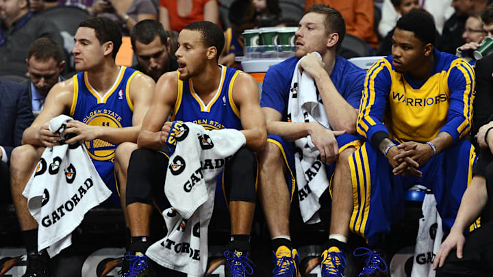 Dec 15, 2013; Phoenix, AZ, USA; Golden State Warriors guard Klay Thompson (left), guard Stephen Curry (left center) , forward David Lee (right center) and guard Kent Bazemore (right) watch from the bench in the first half against the Phoenix Suns at US Airways Center. The Suns defeated the Warriors 106-102. Mandatory Credit: Jennifer Stewart-Imagn Images Dec 15, 2013; Phoenix, AZ, USA; Golden State Warriors guard Klay Thompson (left), guard Stephen Curry (left center) , forward David Lee (right center) and guard Kent Bazemore (right) watch from the bench in the first half against the Phoenix Suns at US Airways Center. The Suns defeated the Warriors 106-102. Mandatory Credit: Jennifer Stewart-Imagn Images
