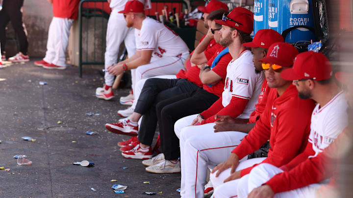 Sep 29, 2024; Anaheim, California, USA; Los Angeles Angels left fielder Taylor Ward (3, fourth from right) watches a game from a dugout during the ninth inning against the Texas Rangers at Angel Stadium. Mandatory Credit: Kiyoshi Mio-Imagn Images Sep 29, 2024; Anaheim, California, USA; Los Angeles Angels left fielder Taylor Ward (3, fourth from right) watches a game from a dugout during the ninth inning against the Texas Rangers at Angel Stadium. Mandatory Credit: Kiyoshi Mio-Imagn Images