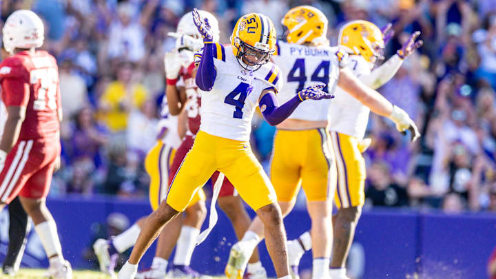 Nov 15, 2025; Baton Rouge, Louisiana, USA;  LSU Tigers cornerback Mansoor Delane (4) reacts to a stop on fourth down against the Arkansas Razorbacks during the second half at Tiger Stadium. Mandatory Credit: Stephen Lew-Imagn Images