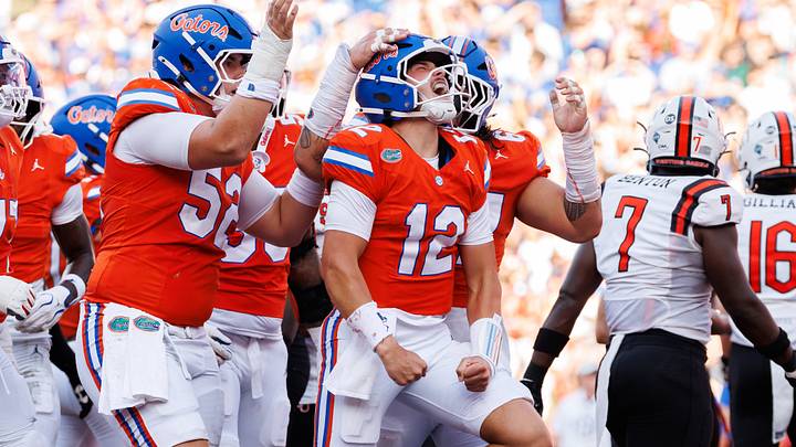 Sep 12, 2026; Gainesville, Florida, USA; Florida Gators quarterback Aaron Philo (12) celebrates with offensive lineman Harrison Moore (52) after scoring a touchdown against the Campbell Fighting Camels during the first half at Ben Hill Griffin Stadium. Mandatory Credit: Matt Pendleton-Imagn Images Sep 12, 2026; Gainesville, Florida, USA; Florida Gators quarterback Aaron Philo (12) celebrates with offensive lineman Harrison Moore (52) after scoring a touchdown against the Campbell Fighting Camels during the first half at Ben Hill Griffin Stadium. Mandatory Credit: Matt Pendleton-Imagn Images