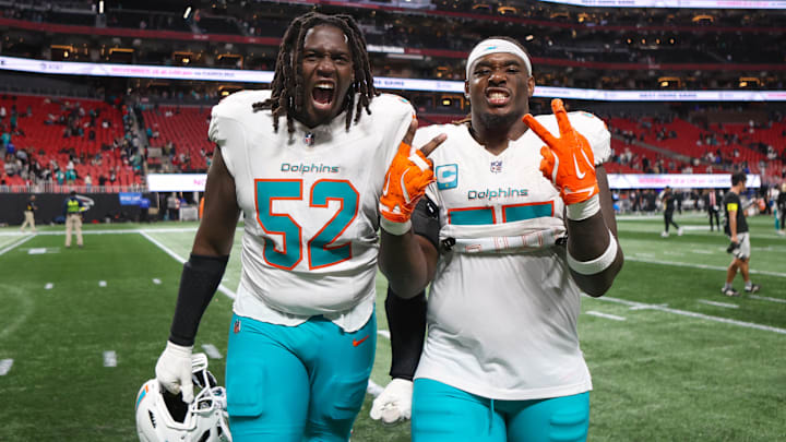 Miami Dolphins offensive tackle Patrick Paul (52) and center Aaron Brewer (55) celebrate after a victory over the Atlanta Falcons at Mercedes-Benz Stadium.