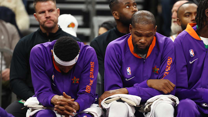 Dec 19, 2024; Phoenix, Arizona, USA; Phoenix Suns guard Bradley Beal (left) and forward Kevin Durant react on the bench against the Indiana Pacers at Footprint Center. Mandatory Credit: Mark J. Rebilas-Imagn Images