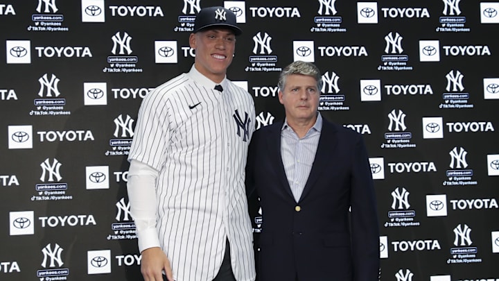 Dec 21, 2022; Bronx, New York, USA; Aaron Judge poses with Hal Steinbrenner during a press conference after being named captain at Yankee Stadium. 