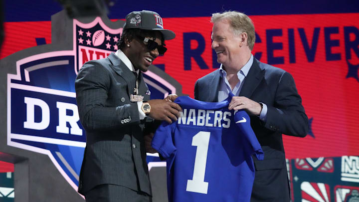 Apr 25, 2024; Detroit, MI, USA; LSU Tigers wide receiver Malik Nabers poses with NFL commissioner