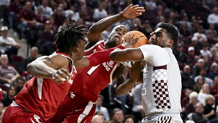 Feb 15, 2025; College Station, Texas, USA; Texas A&M Aggies forward Henry Coleman III (15) is double teamed by Arkansas Razorbacks during the first half at Reed Arena. Mandatory Credit: Maria Lysaker-Imagn Images 