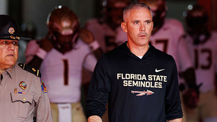 Nov 29, 2025; Gainesville, Florida, USA; Florida State Seminoles head coach Mike Norvell walks out of the tunnel before a game against the Florida Gators at Ben Hill Griffin Stadium. Mandatory Credit: Matt Pendleton-Imagn Images