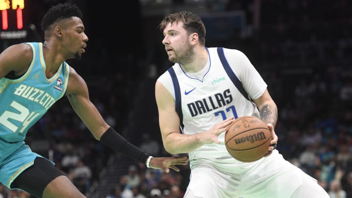 Apr 9, 2024; Charlotte, North Carolina, USA;  Dallas Mavericks guard Luka Doncic (77) looks to shoot