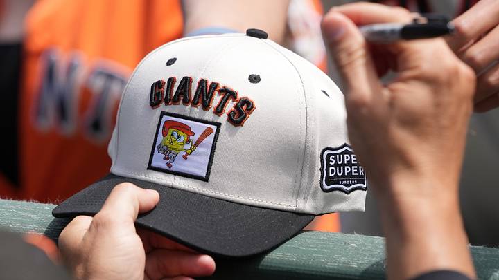 Jul 12, 2026; San Francisco, California, USA; San Francisco Giants manager Tony Vitello (23) holds a SpongeBob SquarePants giveaway hat before the game against the Colorado Rockies at Oracle Park. Mandatory Credit: Darren Yamashita-Imagn Images Jul 12, 2026; San Francisco, California, USA; San Francisco Giants manager Tony Vitello (23) holds a SpongeBob SquarePants giveaway hat before the game against the Colorado Rockies at Oracle Park. Mandatory Credit: Darren Yamashita-Imagn Images